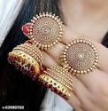 A close-up of a hand holding gold earrings, a fashion accessory and jewelry item titled "Earring 2."